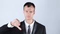 Disappointed young business man with thumb down Royalty Free Stock Photo