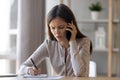 Disappointed young woman having unpleasant phone talk Royalty Free Stock Photo