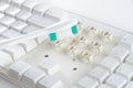 Disassemble and clean up a dirty white keyboard with a toothbrush. Royalty Free Stock Photo