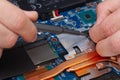 Disassemble the laptop with a screwdriver to repair the cooling system, cooler Royalty Free Stock Photo