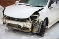 Disassembled damaged car after an accident on the street. Deformed hood Royalty Free Stock Photo