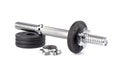 Disassembled dumbbell on discs over white background. Royalty Free Stock Photo