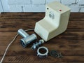 Disassembled electric meat grinder on the wooden table