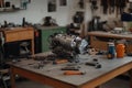 Disassembled engine on a workbench surrounded by tools in a mechanical workshop Royalty Free Stock Photo
