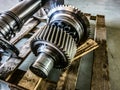 Disassembled gearbox after repair on a wooden rack in a workshop