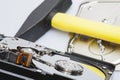 The disassembled hard drive next to the tools with which it was disassembled Royalty Free Stock Photo