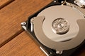 Disassembled hard drive . On the wooden table Royalty Free Stock Photo