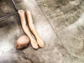 Disassembled Mannequin on Concrete Floor. Mannequin parts scattered on a polished surface Royalty Free Stock Photo