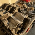 Disassembled metal engine block on bench Royalty Free Stock Photo