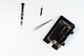 Disassembled mobile phone and screwdriver tool
