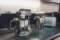 Disassembled multifunctional food processor on kitchen countertops.