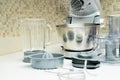 Disassembled multifunctional food processor on kitchen countertops