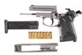 Disassembled pistol with cartridges