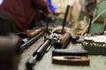 Disassembled shotgun parts and cleaning kit on the wooden table Royalty Free Stock Photo