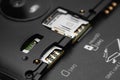 Disassembled smartphone. Close-up of the disassembled gadget with connectors for SIM cards Royalty Free Stock Photo