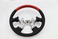 The disassembled steering part before installation of the equipment is a carbon alutex fibre orange wheel with soft genuine