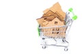 Disassembled toy house in a small push cart Royalty Free Stock Photo