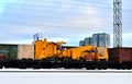 Disassembled yellow mining truck loaded onto a railway platform costs railway tracks