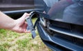 Disassembling and removing the fog lamp from a car to replace a burnt out light bulb. Close-up Royalty Free Stock Photo