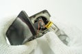 Disassembly car camera to replace new battery on white background, isolated, Car maintenance service Royalty Free Stock Photo
