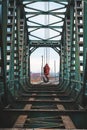 Disassembly and cutting of the old steel railway bridge and rusty rails