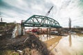 Disassembly and cutting of the old steel railway bridge and rusty rails