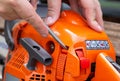 Disassembly and removal of the chainsaw casing for subsequent repair and adjustment. Benhopil adjustment service center