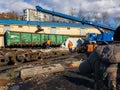 A disaster recovery train hoists a gondola car with a crane. Royalty Free Stock Photo