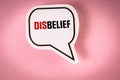 DisBelief. Speech bubble with text on pink background Royalty Free Stock Photo