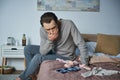 disbelieve, depressed man sitting on bed Royalty Free Stock Photo