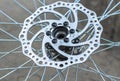 Disc brake of a front bicycle wheel close-up