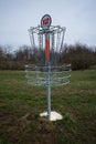 Disc, or frisbee, golf target with metal chains on a meadow Royalty Free Stock Photo