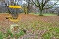 disc golf basket target in autumn park Royalty Free Stock Photo