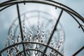 Underneath a disc golf goal looking up with selective focus on the chain basket. Royalty Free Stock Photo