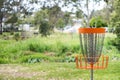 Disc golf (frolf) basket in a park Royalty Free Stock Photo