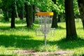 Disc golf target basket in forest for popular leisure activity Royalty Free Stock Photo