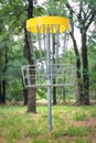 Disc golf target basket in wooded park