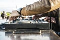 Disc jockey hands playing music for tourist people at beach party outdoor - Live event, music and fun concept - Entertainment and Royalty Free Stock Photo