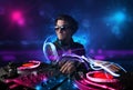 Disc jockey playing music with electro light effects and lights Royalty Free Stock Photo