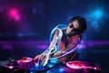 Disc jockey playing music with electro light effects and lights Royalty Free Stock Photo