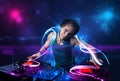 disc jockey playing music with electro light effects and lights Royalty Free Stock Photo