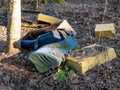 Discarded and abandoned parts of an old couch in the forest Royalty Free Stock Photo