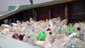 Discarded bottles clutter derelict vessel boat, beach backdrop marine rubbish issue. Accumulation neglect, impact on