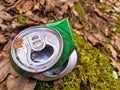 Discarded green aluminium beer or soda can in a forest Royalty Free Stock Photo