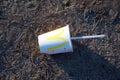 Discarded Mcdonalds paper cup, cola and fast food packaging on the ground. People left behind trash. Fast food rubbish. Russia,