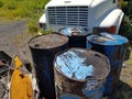 Discarded metal barrels rusting