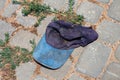 Discarded old baseball cap lying on the ground. Morocco, Africa