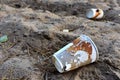 Discarded Paper coffee cup on ground. Disposable coffee cups on sand. The problem of environmental pollution. Pile of abandoned