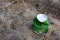 Discarded Paper coffee cup on ground. Disposable coffee cup on sand. The problem of environmental pollution. Pile of abandoned