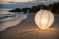 A discarded paper lantern tangled in the sea oats